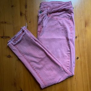 Washed red Levi’s with raw hem